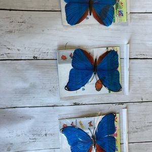 Three 3D blue butterfly stickers for wall